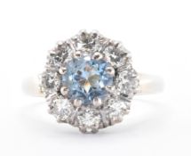 18CT GOLD AQUAMARINE & DIAMOND CLUSTER RING