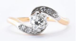 18CT GOLD, PLATINUM AND DIAMOND CROSSOVER RING