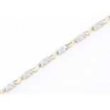 9CT GOLD AND DIAMOND TENNIS BRACELET