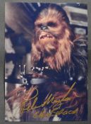 STAR WARS - PETER MAYHEW (1944-2019) - SIGNED 5X7" COLOUR PHOTO