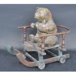 VINTAGE 20TH CENTURY CARVED WOODEN CHILDRENS TOY BEAR ON A CART