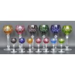 COLLECTION OF MULTICOLOUR CRYSTAL CUT GLASS DRINKING GLASSES