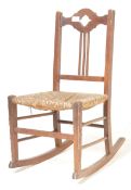 EARLY 20TH CENTURY ARTS & CRAFTS MINATURE ROCKING CHAIR