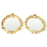 TWO 20TH CENTURY GILT WALL HANGING OVAL MIRRORS