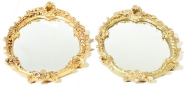 TWO 20TH CENTURY GILT WALL HANGING OVAL MIRRORS