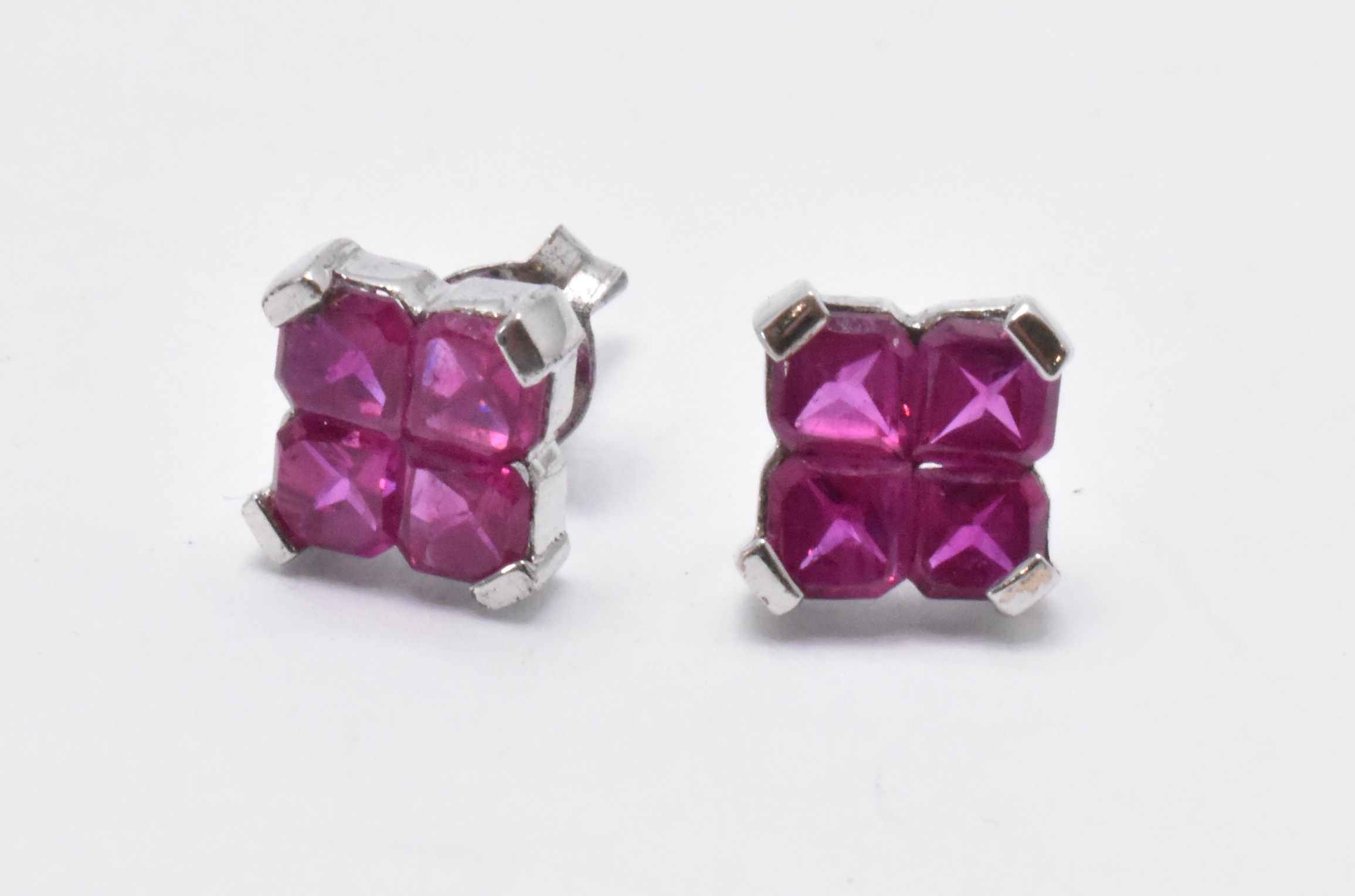 PAIR 9CT WHITE GOLD AND RUBY STUD EARRINGS