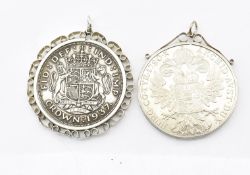 TWO MOUNTED SILVER COIN PENDANTS