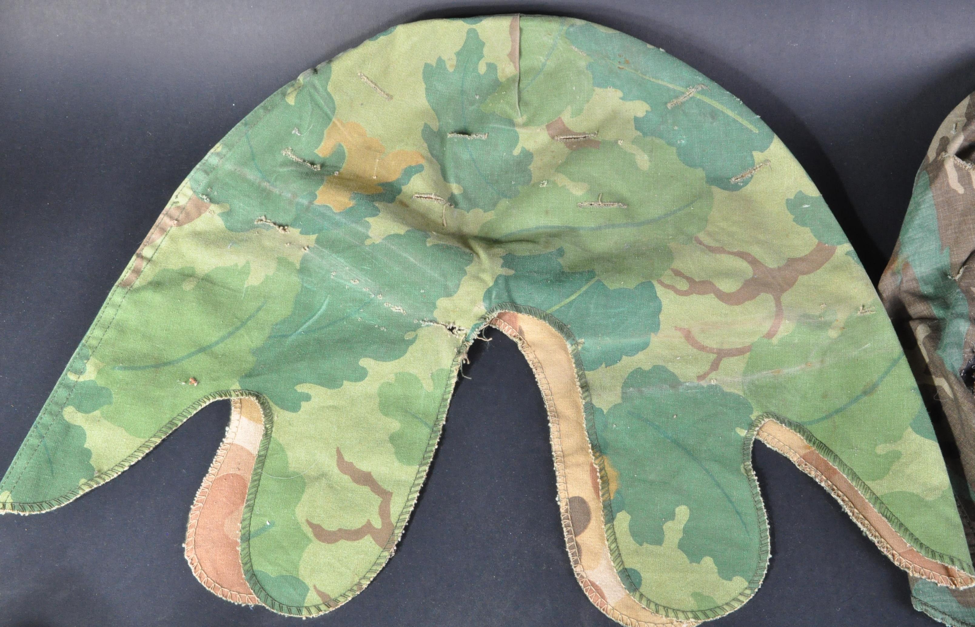 COLLECTION OF FOUR 20TH CENTURY CAMOUFLAGE HELMET COVERS - Image 4 of 6