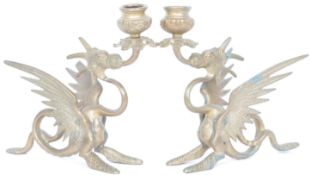 PAIR BRONZE CANDLESTICKS IN THE FORM OF A GRIFFIN