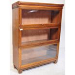 An early 20th century three tier Globe Wernicke style lawyers bookcase having glazed up and over