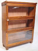 An early 20th century three tier Globe Wernicke style lawyers bookcase having glazed up and over