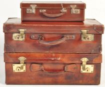 TRIO OF VINTAGE LEATHER SUITCASES