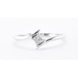 18CT WHITE GOLD & DIAMOND CROSSOVER RING