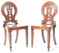 MATCHING PAIR OF VICTORIAN MAHOGANY CARVED HALL CHAIRS