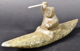 LARGE INUIT ART HAND CARVED FIGURINE IN KAYAK