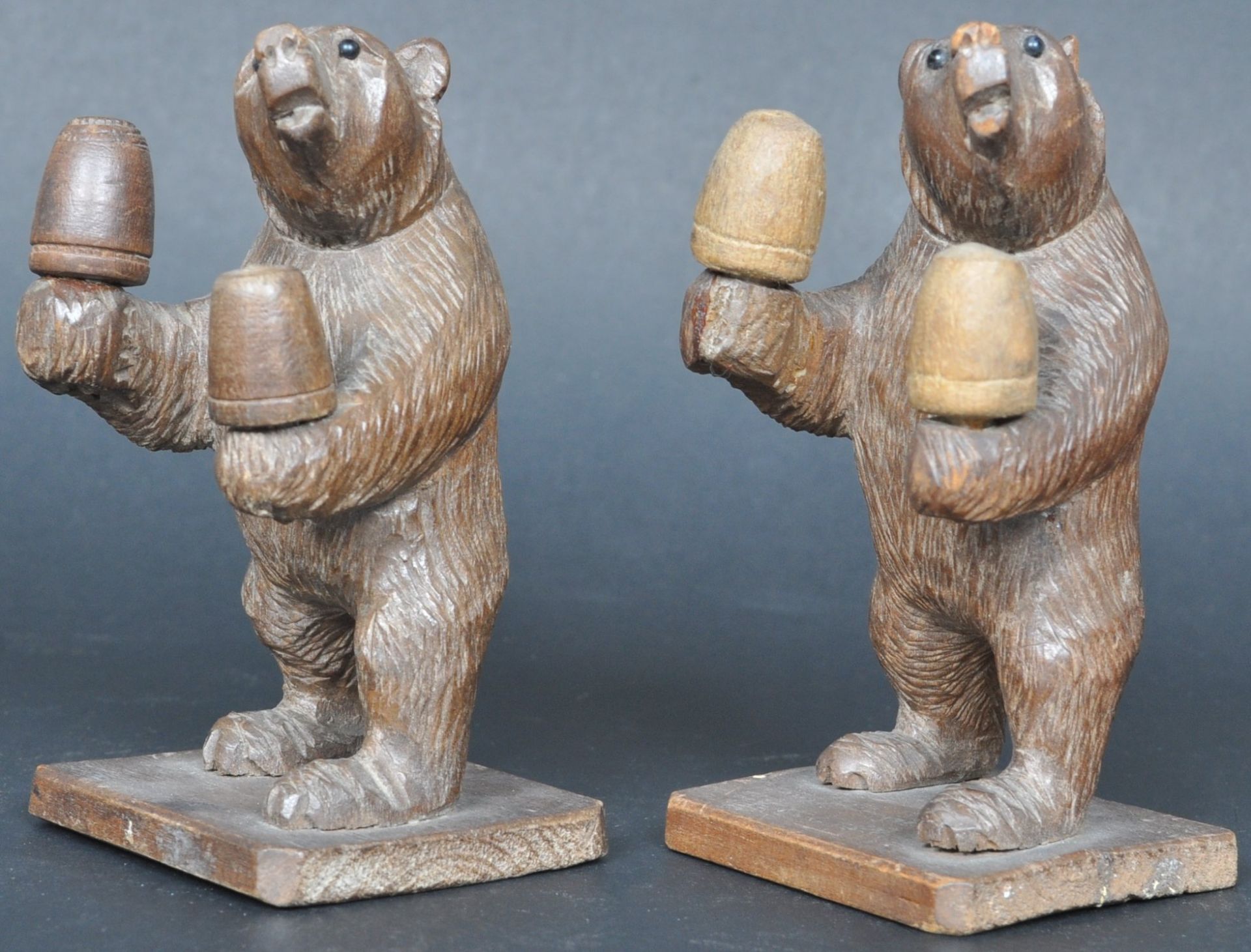 PAIR OF 19TH CENTURY BLACK FOREST CARVED BEAR THIMBLE HOLDERS