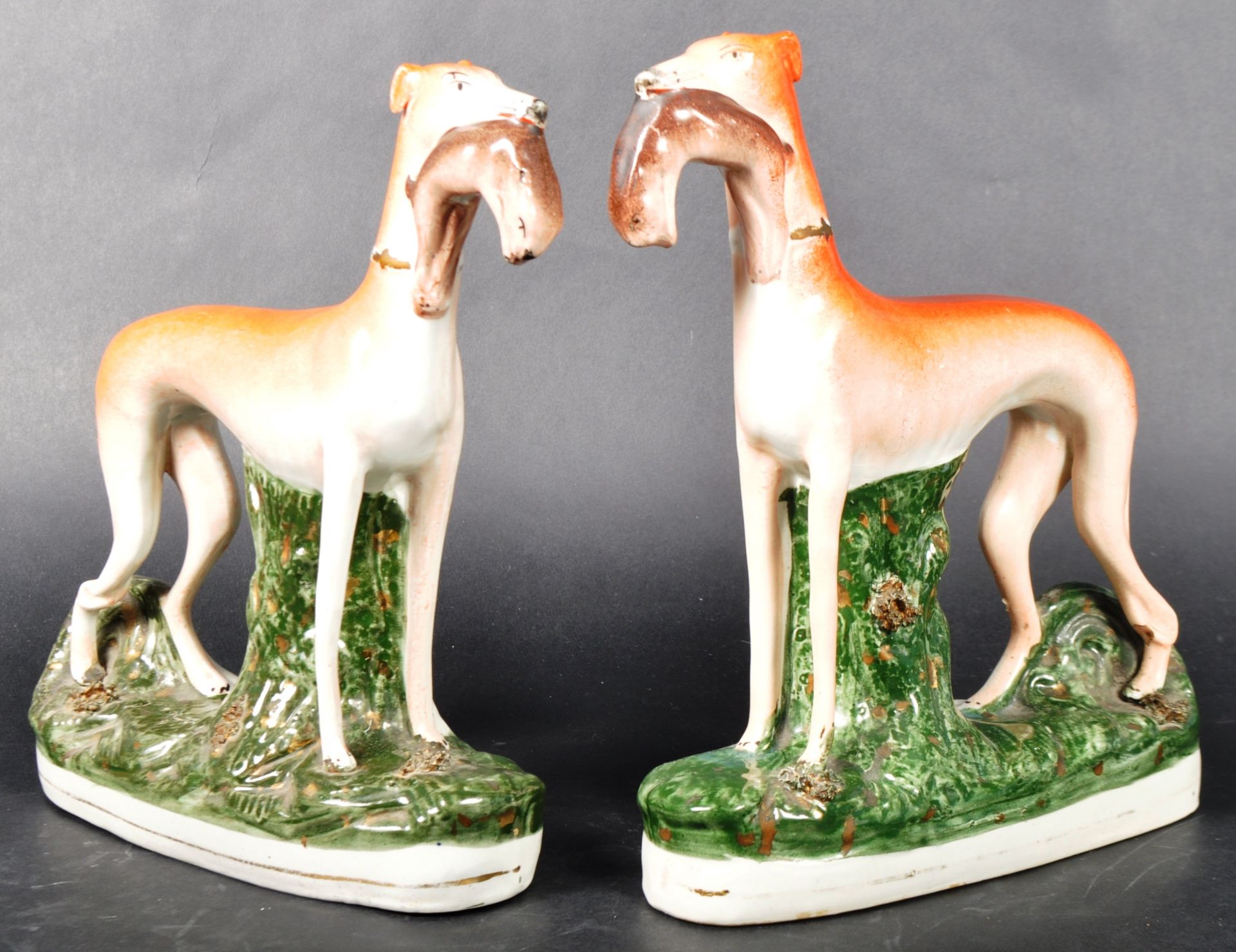 MATCHING PAIR OF 19TH CENTURY STAFFORDSHIRE SPORTING HOUNDS