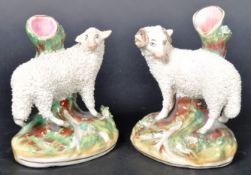 PAIR OF 19TH CENTURY STAFFORDSHIRE RAM & SHEEP SPILL VASES