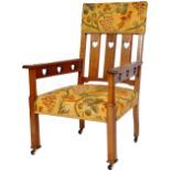 20TH CENTURY ARTS & CRAFTS ARMCHAIR IN THE MANNER OF CFA VOYSEY