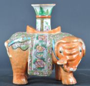 19TH CENTURY CHINESE FAMILLE ROSE ELEPHANT CANDLESTICK