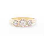 18CT GOLD & DIAMOND THREE STONE RING