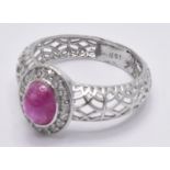 18CT WHITE GOLD CABOCHON BURMA RUBY & DIAMOND HALO RING