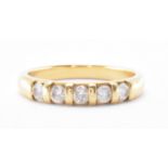 HALLMARKED 18CT GOLD & DIAMOND FIVE STONE RING