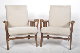 MATCHING PAIR OF RETRO OAK FRAMED EASY LOUNGE ARMCHAIRS