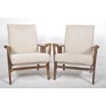 MATCHING PAIR OF RETRO OAK FRAMED EASY LOUNGE ARMCHAIRS