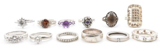 TWELVE MIXED SILVER STONE SET RINGS