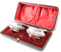 PAIR OF SILVER HALLMARKED TABLE SALTS IN CASE