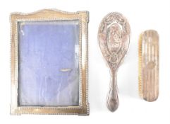 EDWARDIAN SILVER HALLMARKED PHOTOFRAME & SILVER BACKED BRUSHES