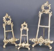 THREE BRASS ROCOCO STYLE EASEL PICTURE STANDS