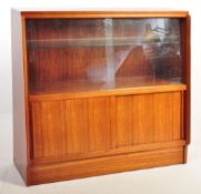 A 1960S VINTAGE TWIN DOOR GLASS TEAK BOOKCASE