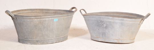 TWO EARLY 20TH CENTURY GALVANISED TIN TUBS