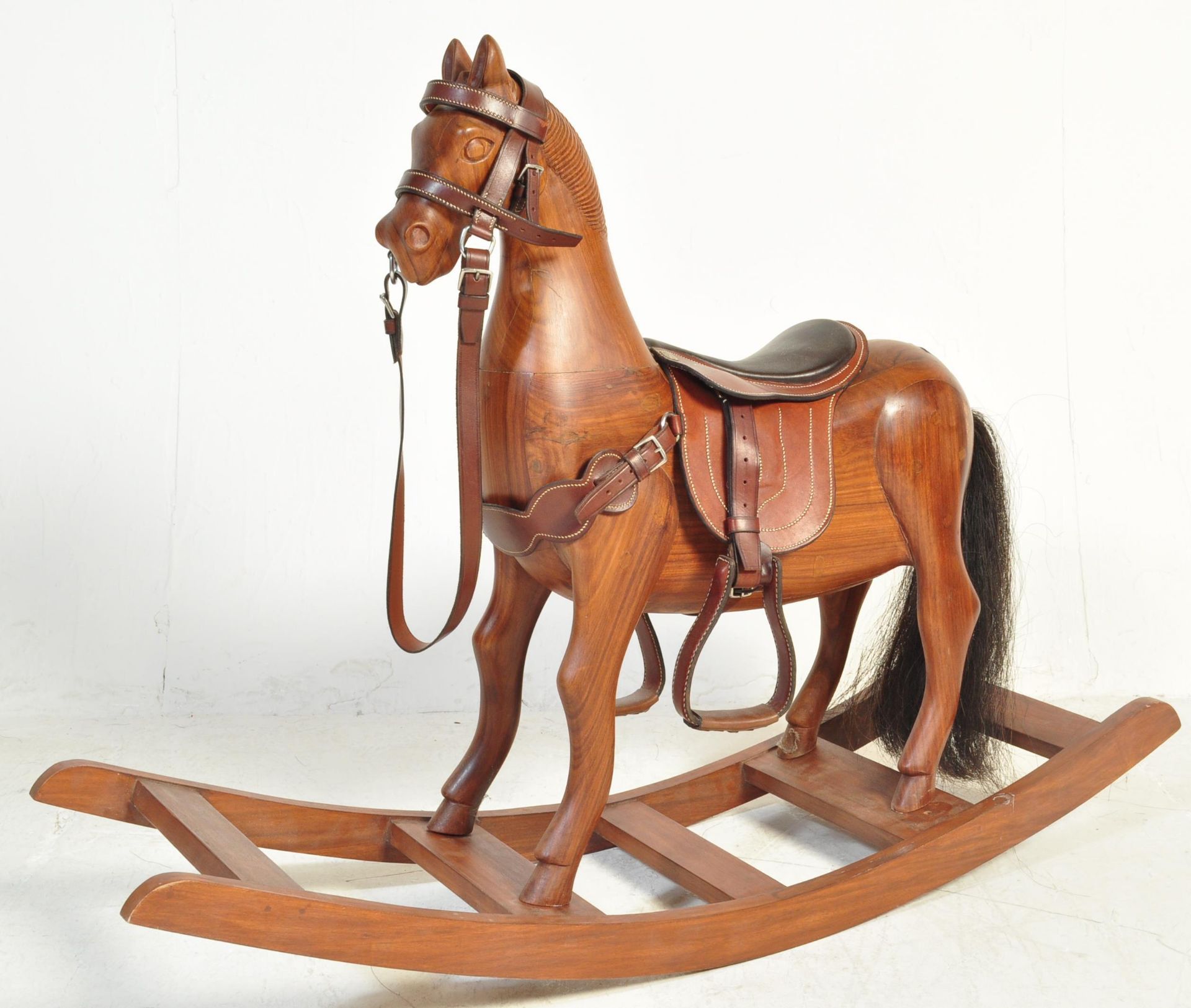 20TH CENTURY WOODEN ROCKING HORSE WITH LEATHER SADDLE