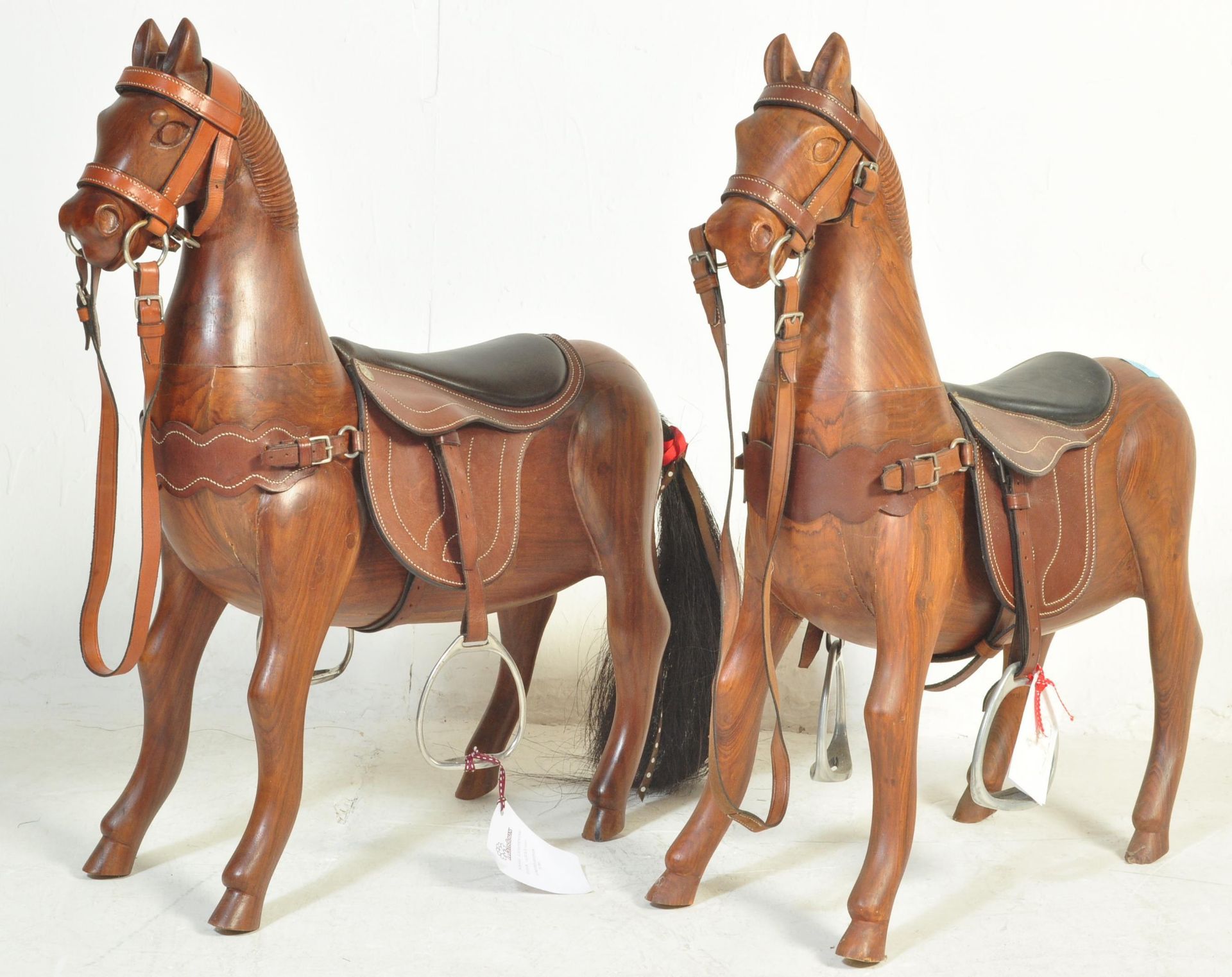 PAIR OF 20TH CENTURY WOODEN ROCKING HORSES