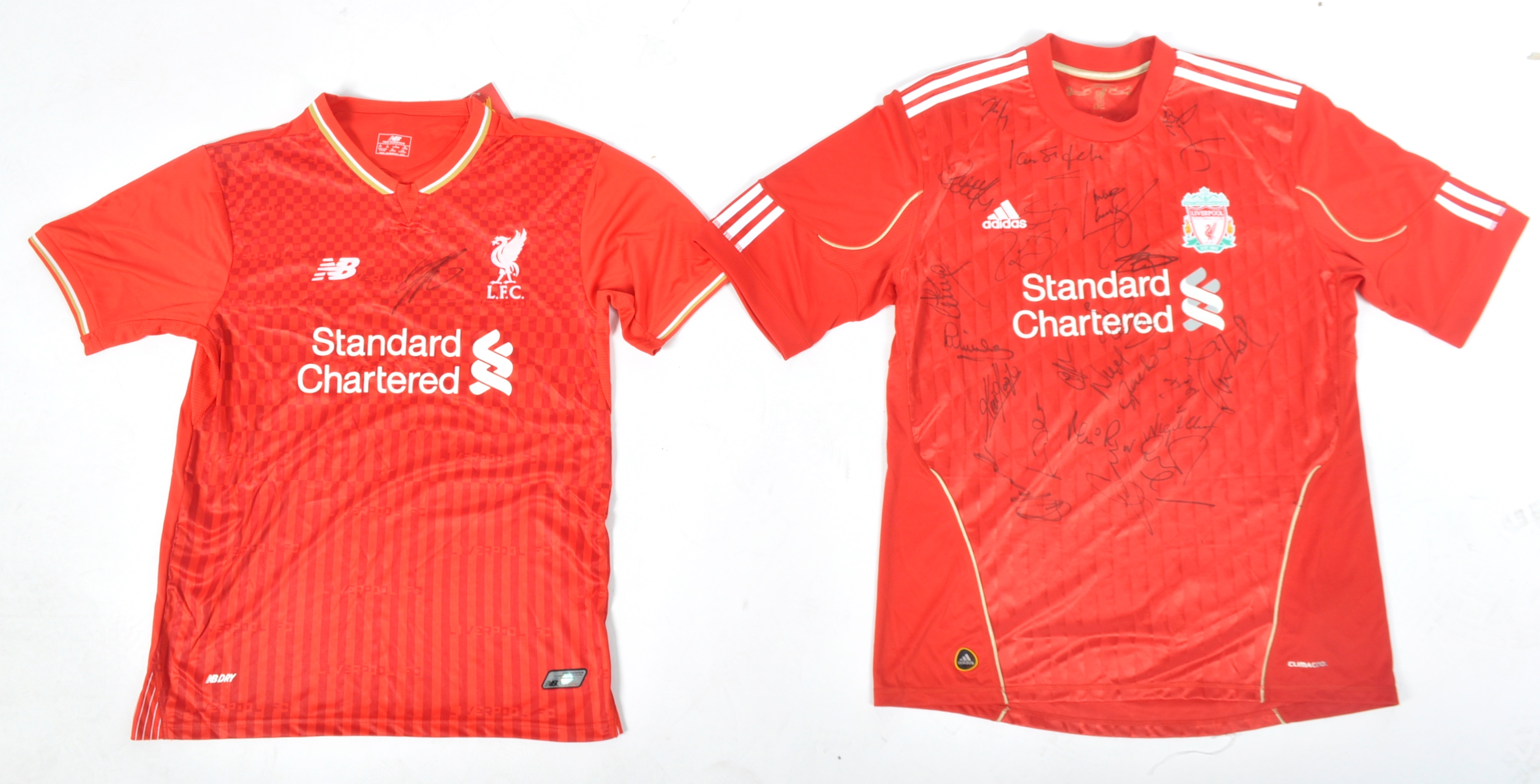 LIVERPOOL FOOTBALL CLUB - A PAIR OF SIGNED RED HOME SHIRTS