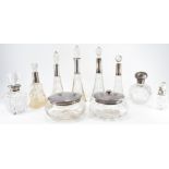 GROUP OF EDWARDIAN SILVER COLLARED SCENT BOTTLES
