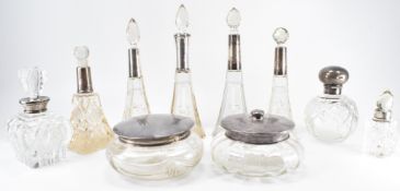 GROUP OF EDWARDIAN SILVER COLLARED SCENT BOTTLES