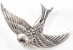 A SILVER LADIES BROOCH IN THE SHAPE OF A SWALLOW WITH RUBY TO EYE