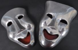 H.N. HANDICRAFTS - PAIR OF POLISHED METAL THEATRICAL MASKS