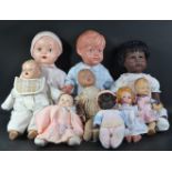 COLLECTION OF VINTAGE PLASTIC AND BISQUE HEADED DOLLS