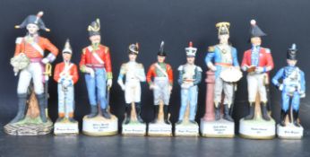 NINE VINTAGE MILITARY RELATED SOLDIERS