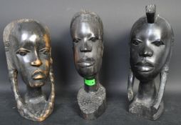 THREE AFRICAN CARVED WOOD BUST SCULPTURES
