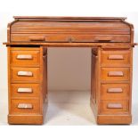 AN EARLY 20TH CENTURY OAK ROLL TOP TWIN PEDESTAL DESK