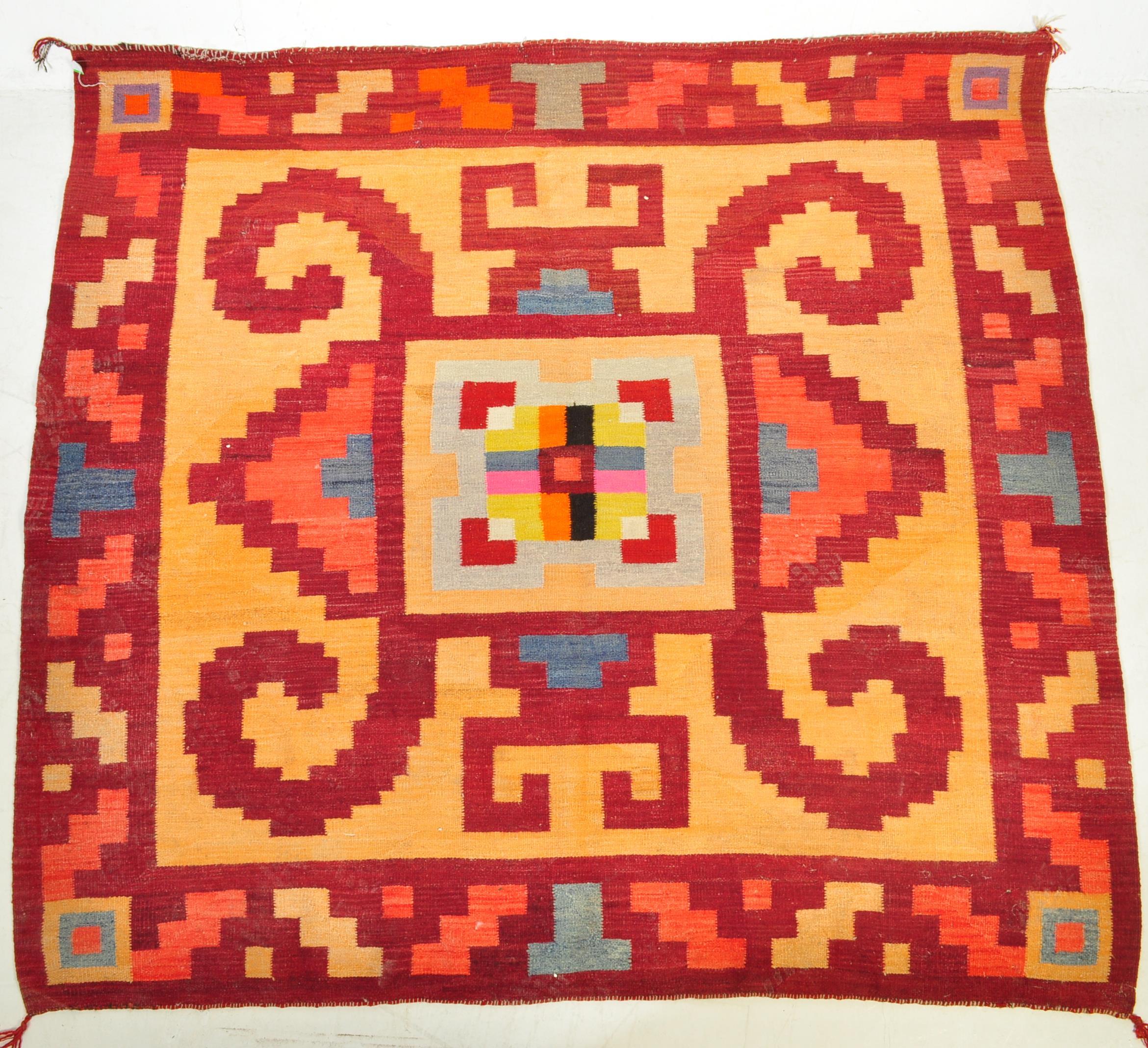 A VINTAGE SOUTH AMERICAN NAVAJO KILIM STYLE FLOOR RUG