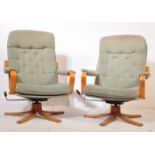 A PAIR OF MID 20TH CENTURY 1970S UPHOLSTERED SWIVEL CHAIRS