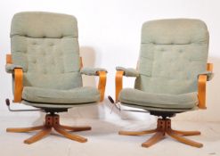 A PAIR OF MID 20TH CENTURY 1970S UPHOLSTERED SWIVEL CHAIRS