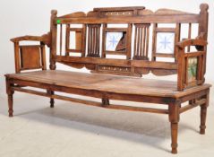 A VINTAGE INDIAN ROTATING BACK REST TEAK BENCH